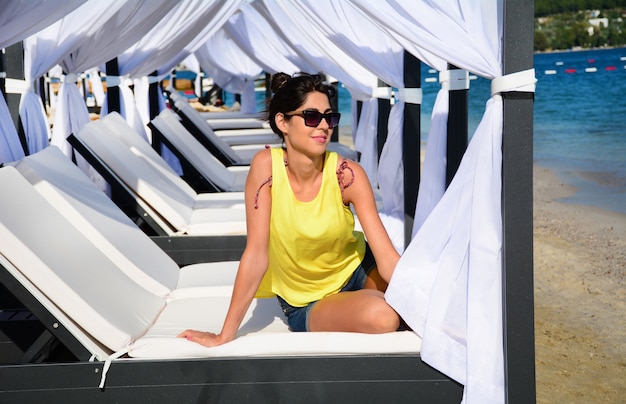 Woman sitting on a hammock