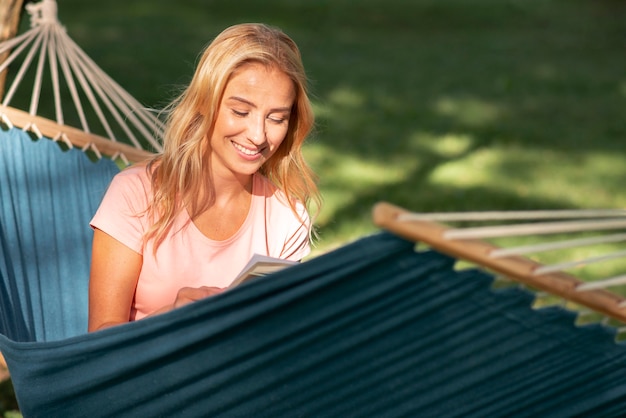 Free photo woman sitting in hammock