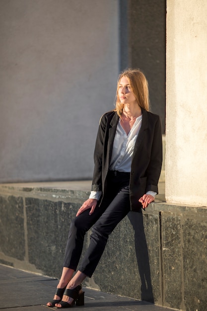 Woman sitting and looking away