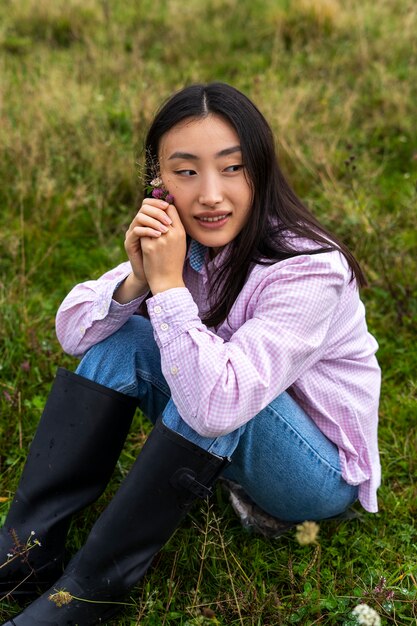 Woman sitting outdoors high angle