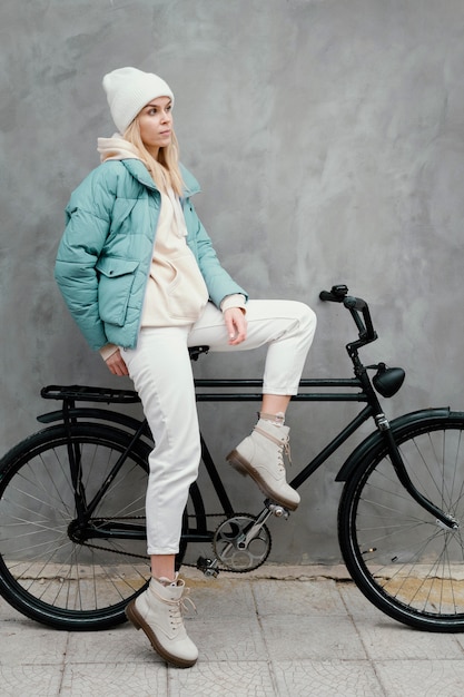 Woman sitting sideways on her bike