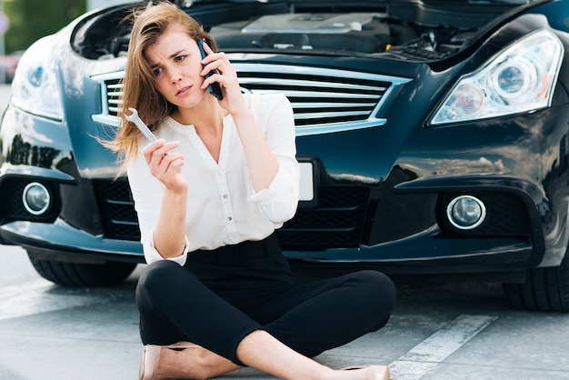 Woman sitting and talking on phone