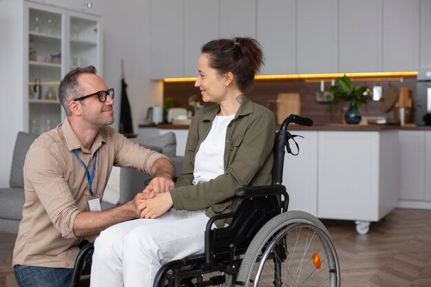 Woman sitting in wheelchair medium shot