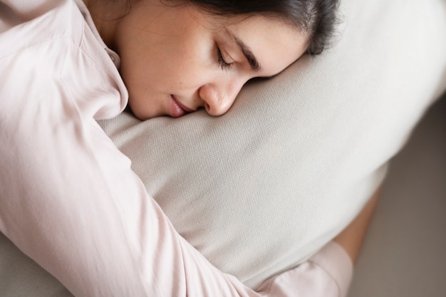 Woman sleeping comfortably on her pillow