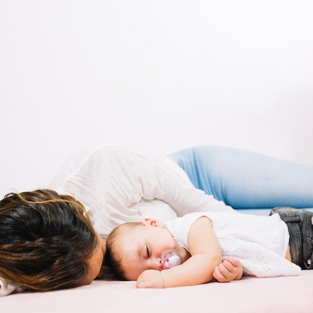 Woman sleeping with baby