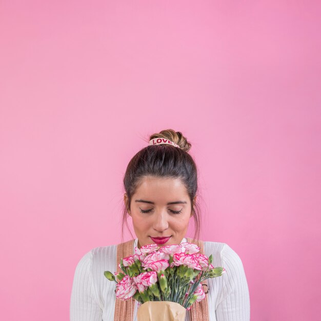 Woman smelling flowers bouquet 