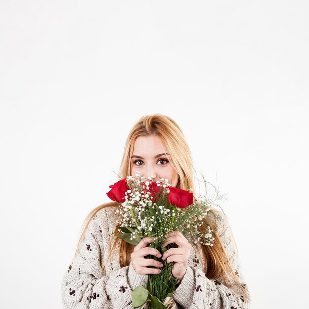 Woman smelling flowers