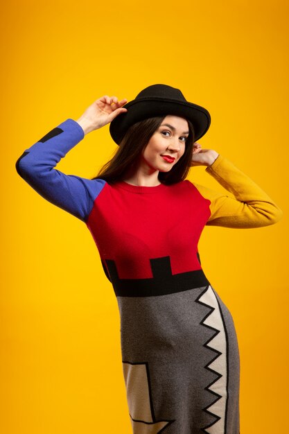 Woman smiles while posing in studio