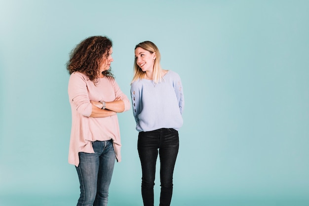 Woman smiling to angry mother