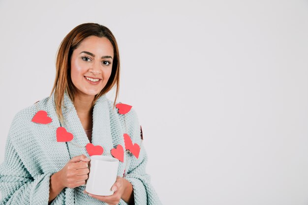 Woman smiling and holding cup