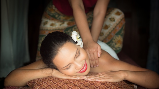 Woman smiling while giving a massage