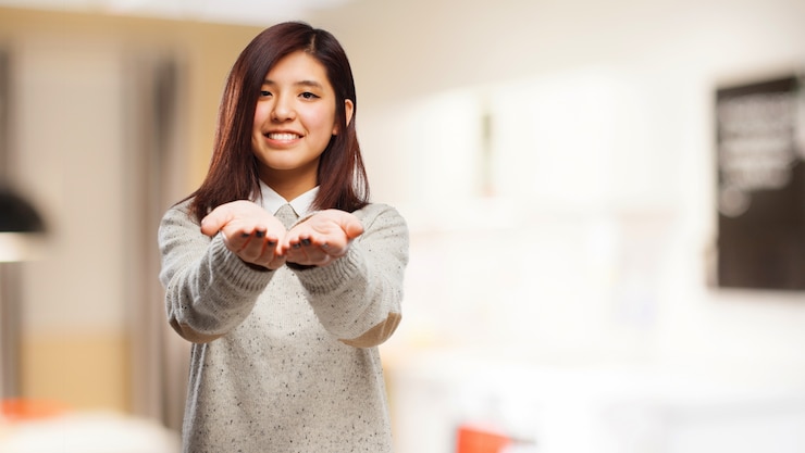 Free Photo woman smiling with outstretched hands