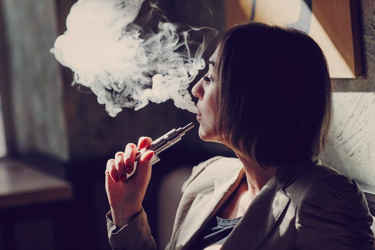 Free Photo woman smoking vapor