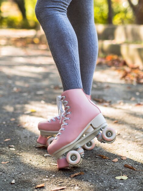 Woman in socks posing with roller skates