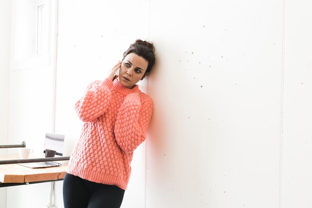 Woman speaking on phone at home