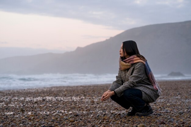 Woman spending time in nature full shot