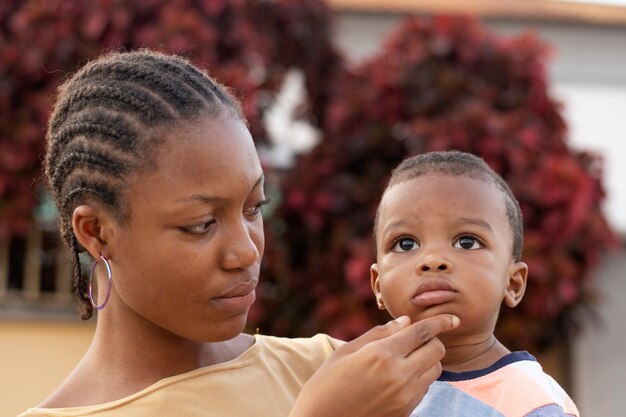 Woman spending time with her black baby boy