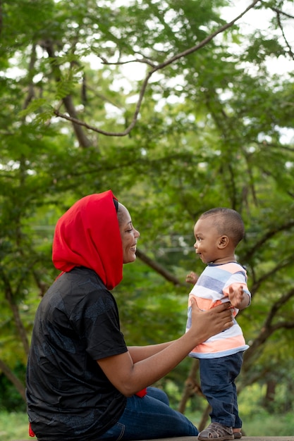 Woman spending time with her black baby boy