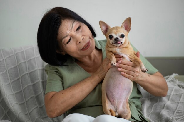 Woman spending time with her dog at home