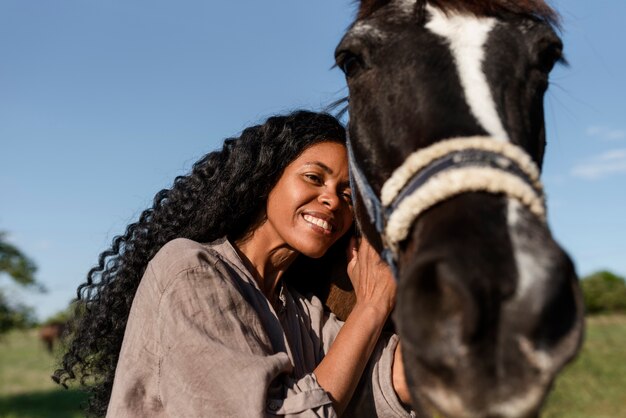 Woman spending time with her horse