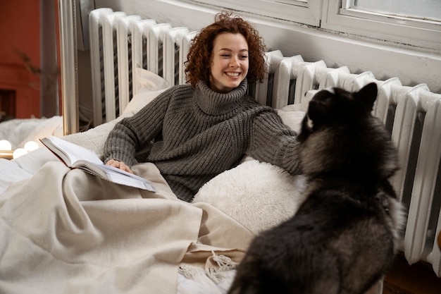 Free photo woman spending time with her pet