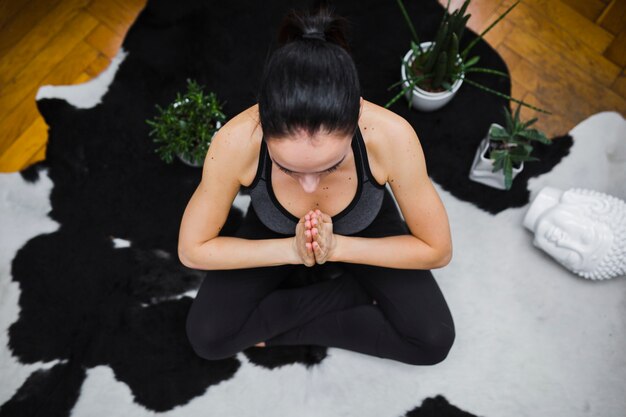 Woman in sportswear meditating