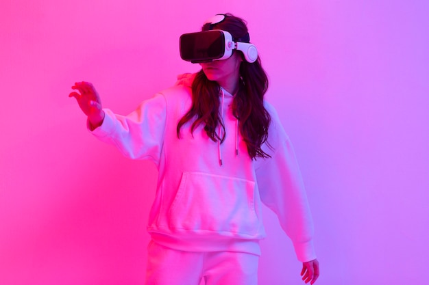 Woman in sportswear using virtual reality goggles