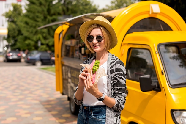 Woman standing by the food truck