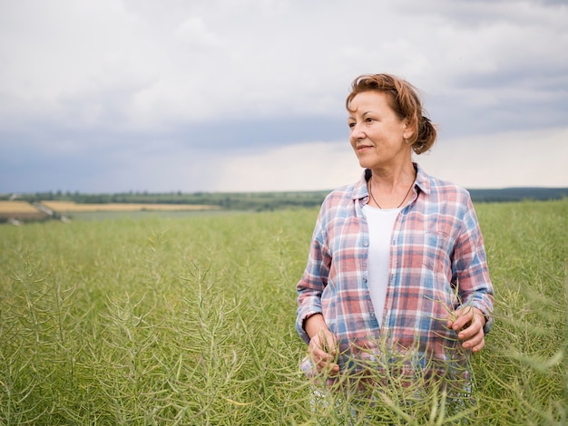 Woman standing in a field with copy space
