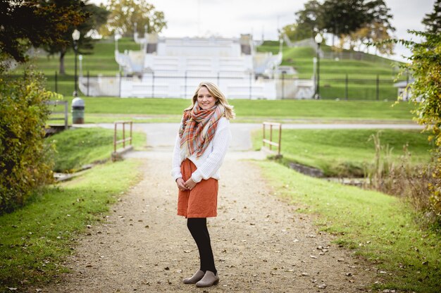 Woman standing on a pathway and smiling