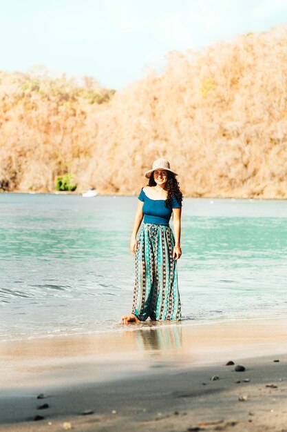 Woman standing on seashore