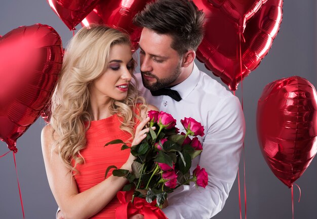 Woman standing with a bouquet of cut roses