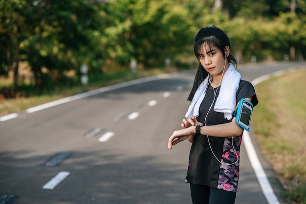 A woman stood relaxed after exercising.