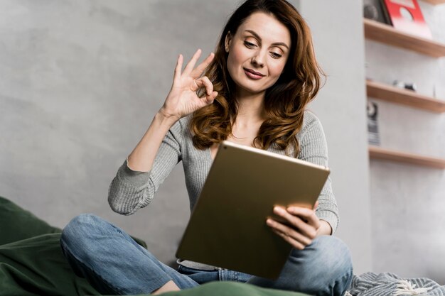 Woman streaming with tablet