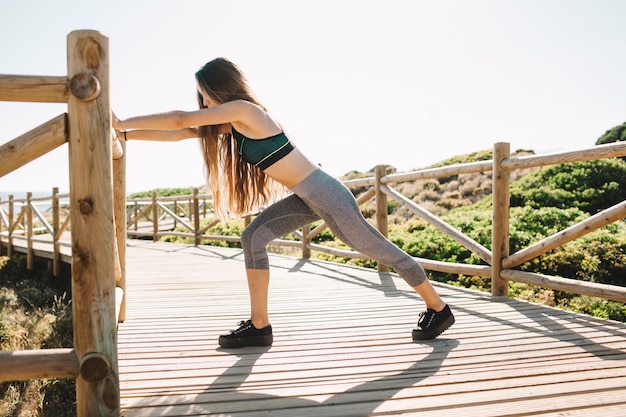 Woman stretching at the beach