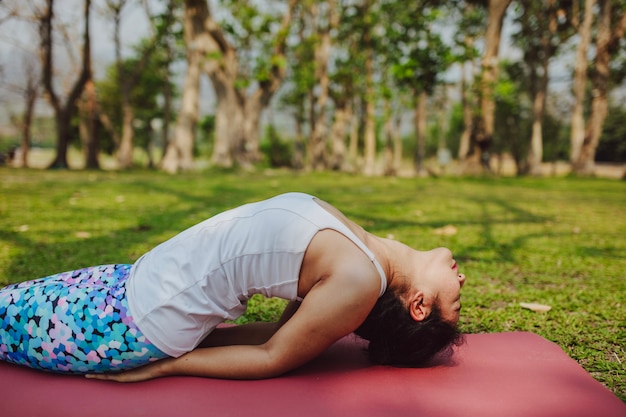 Woman stretching on the grass