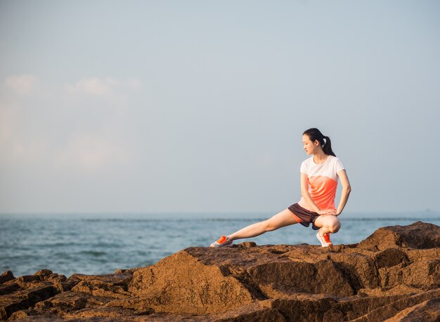 Woman stretching her leg