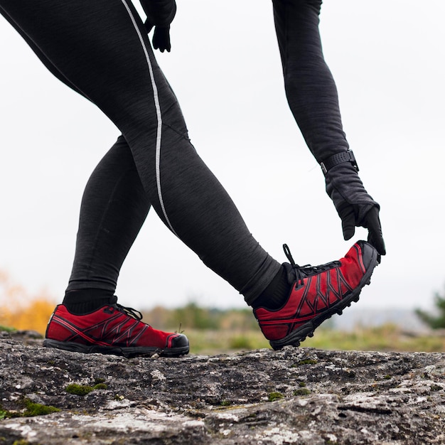 Woman stretching her legs before running