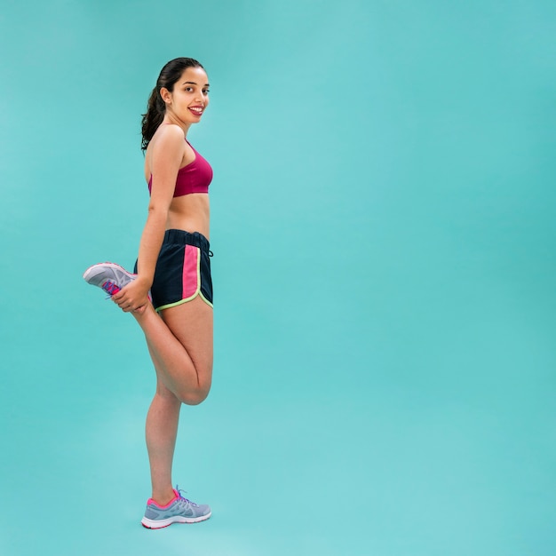 Woman stretching legs sideways