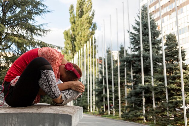 Woman stretching in nature full shot