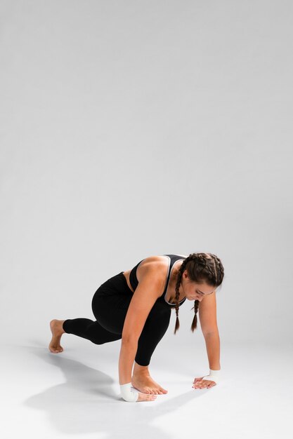 Woman stretching with copy space background