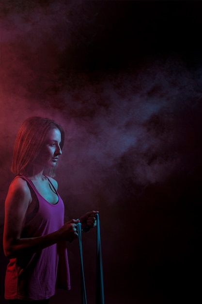 Woman stretching with rope