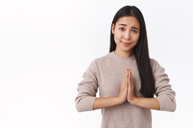 woman, student begging classmate copy her homework, press palms together over chest in pray