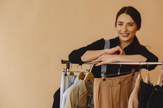 woman in a studio with many clothes