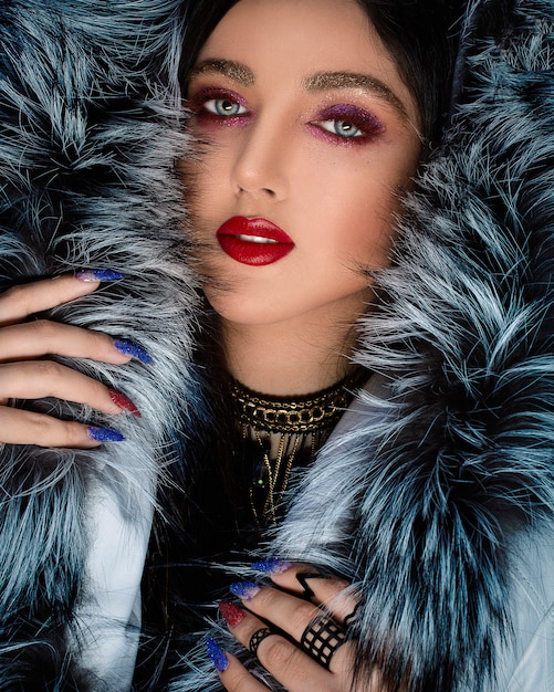 Woman in style makeup and fur