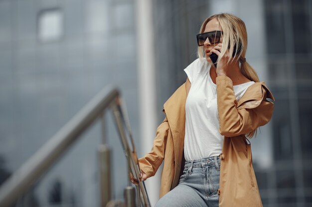 Woman in a stylish clothes in a summer city