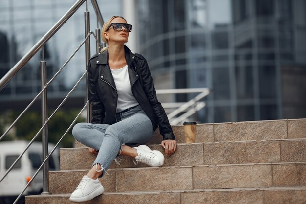 Woman in a stylish clothes in a summer city