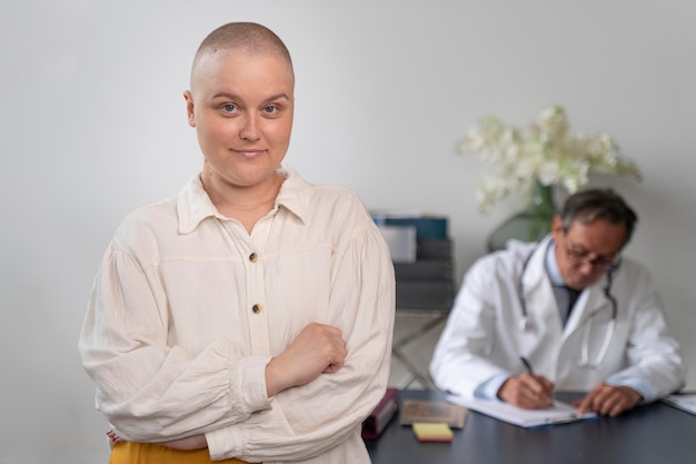 Woman suffering of breast cancer talking with her doctor