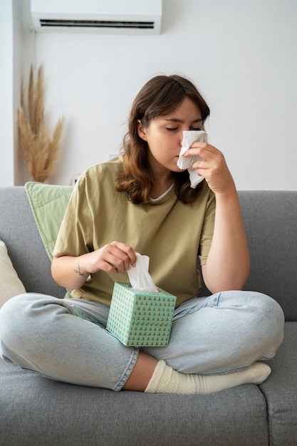 Woman suffering from allergies front view