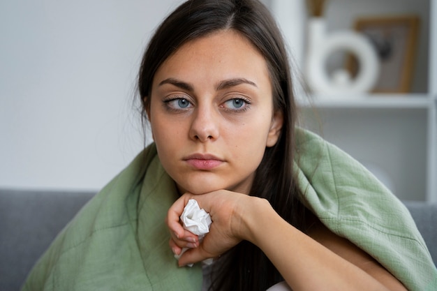 Free photo woman suffering from allergies front view